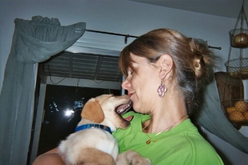 Marcy holds a Zuzu puppy